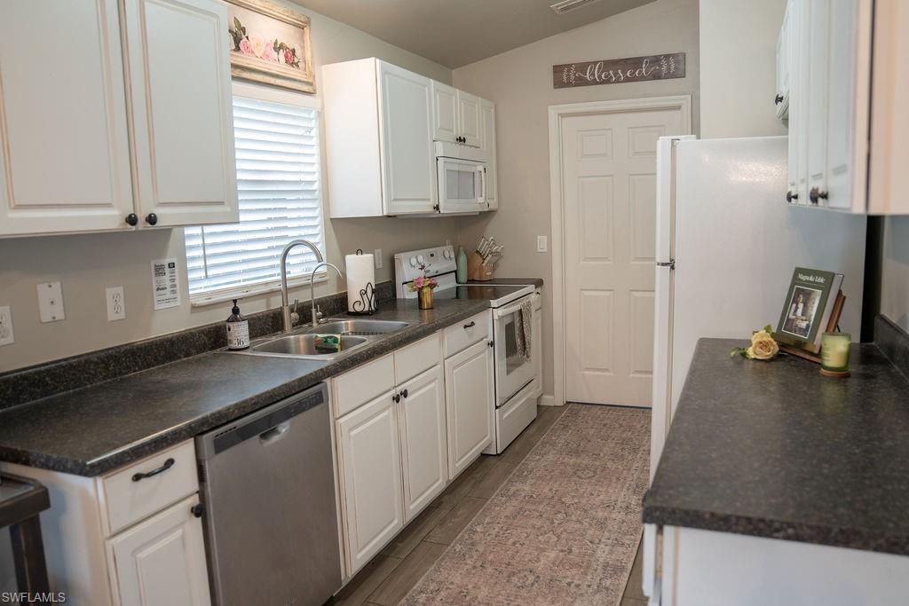 The kitchen has a great view of the lanai & backyard.