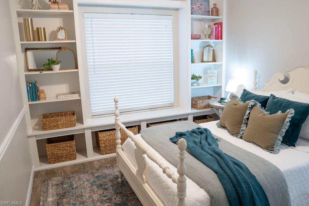 GUEST BEDROOM WITH BUILLT IN SHELVES.