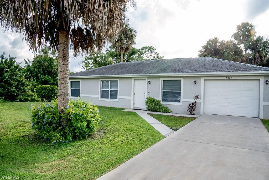 Block home with beautiful landscape.