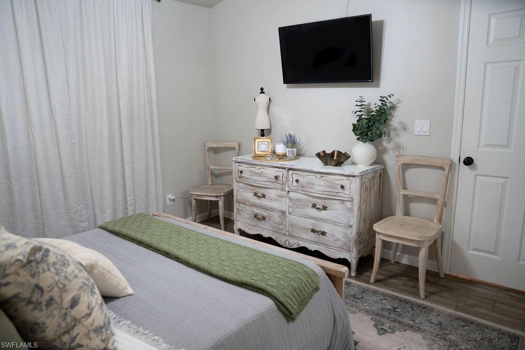 PRIMARY BEDROOM WITH TV.