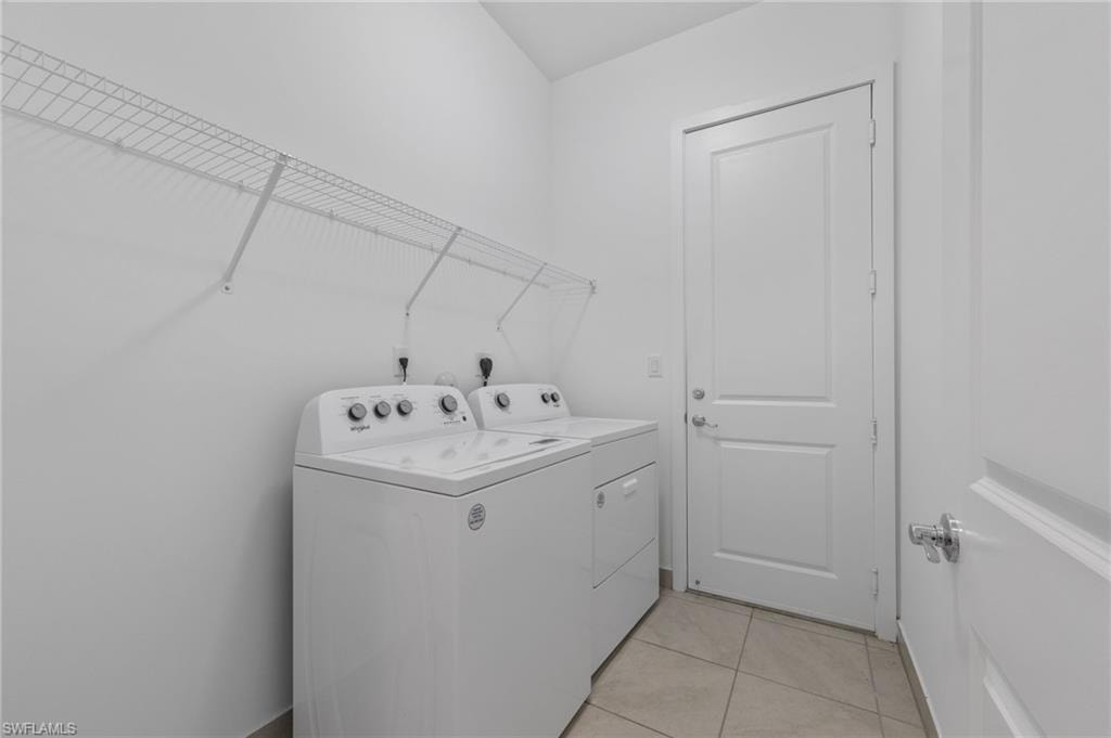 Laundry area featuring tile flooring and wire shelving