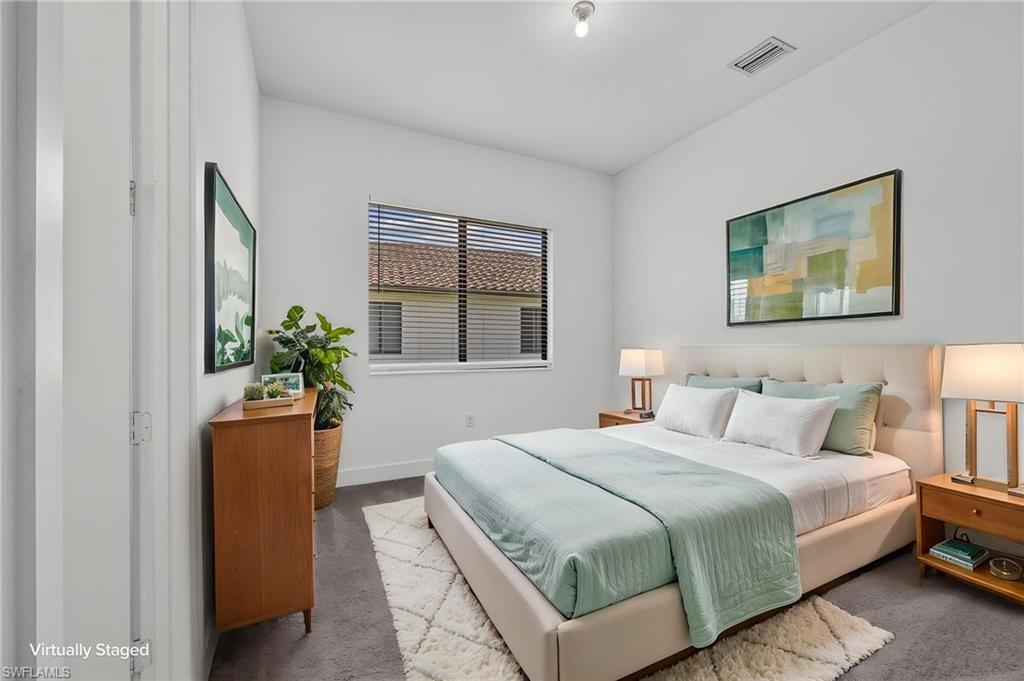 Recessed lighting, window with horizontal blinds, and a built-in closet with a white door