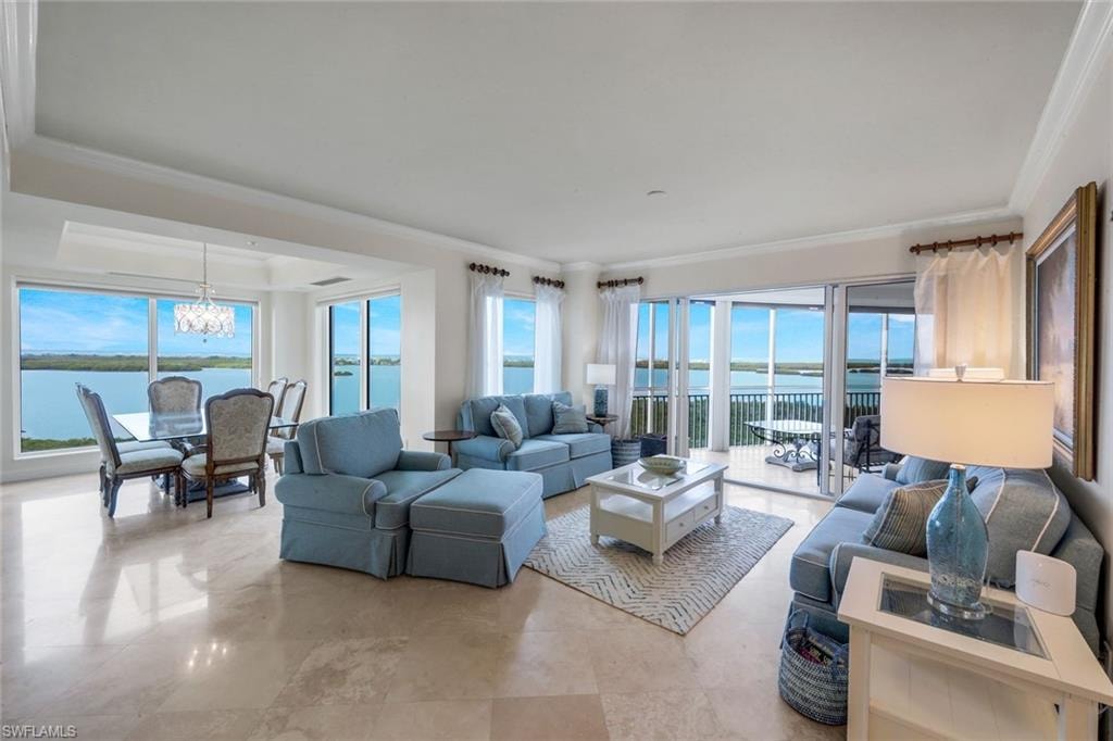 The spacious living and dining area of the home feature Floor-to-ceiling windows offering breathtaking views.  Beautiful marble flooring runs throughout the main living areas of the home.