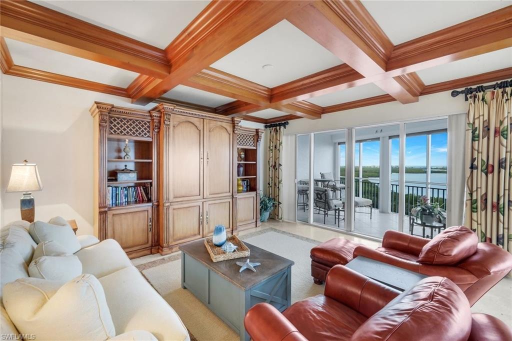 The family room, with its wood beam ceiling accent, opens to a spacious west facing lanai.