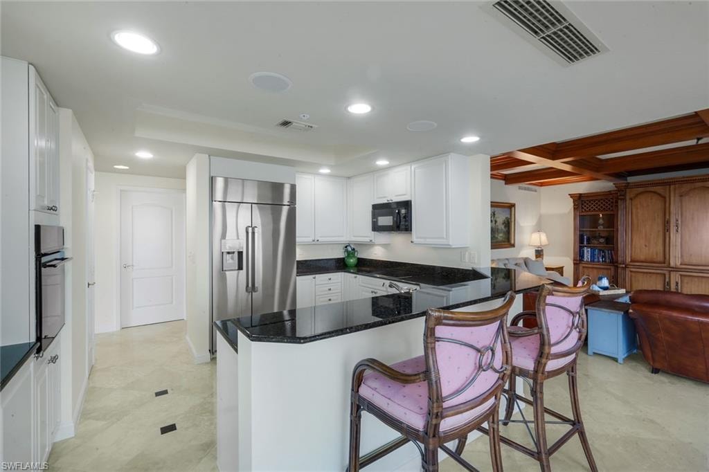 The kitchen, the heart of the home, is centrally located between the living/dining area and the family room.