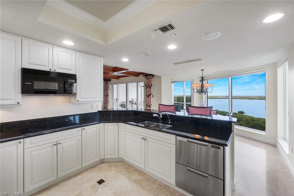 The kitchen has been refreshed with newly painted upgraded wood cabinets.