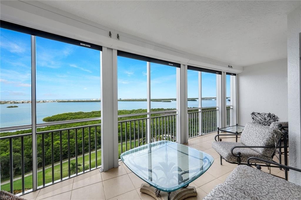 Spacious lanai with views of Estero Bay and the Gulf accesses the primary Bedroom and the Living room.  Electric storm shutters provide additional protection and make buttoning up a snap.