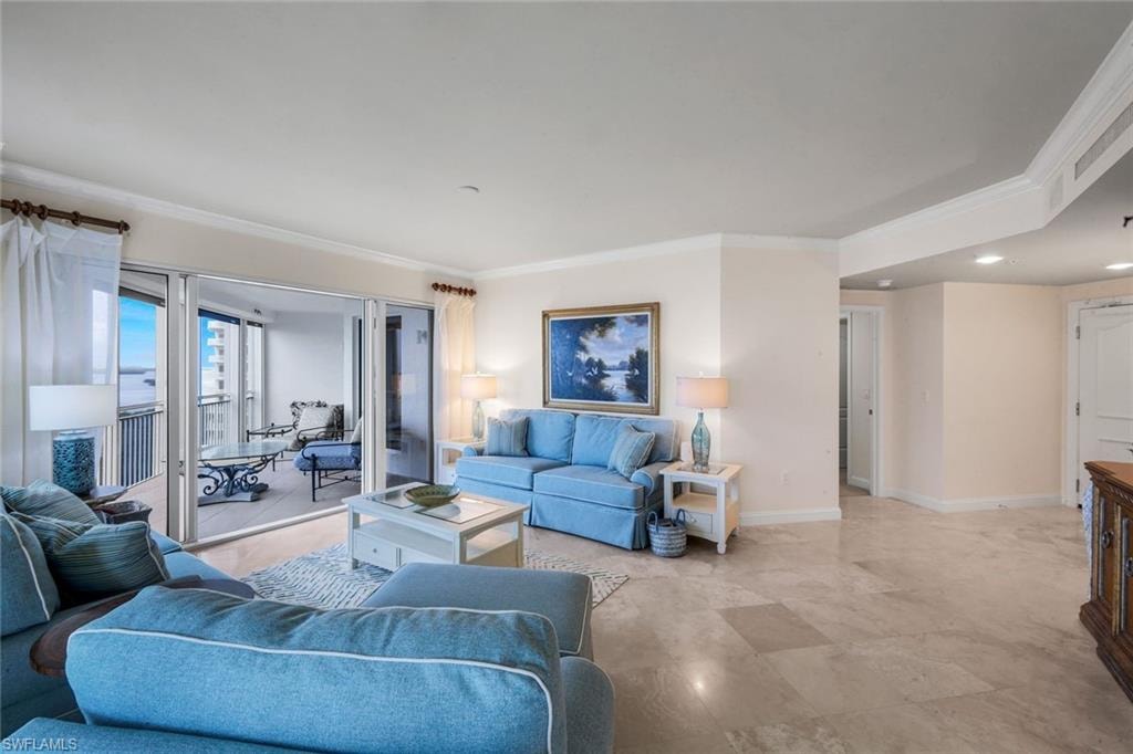 The living room opens to a spacious lanai, the perfect spot for enjoying sunsets over the Gulf.