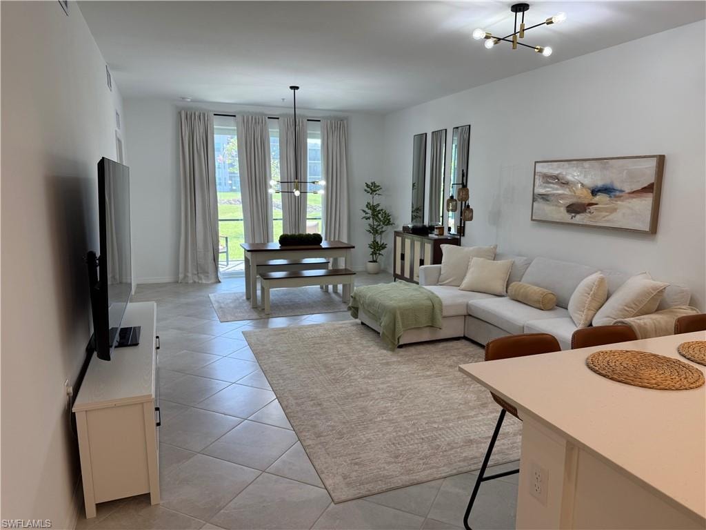 Open-concept living space featuring tiled flooring and neutral wall tones
