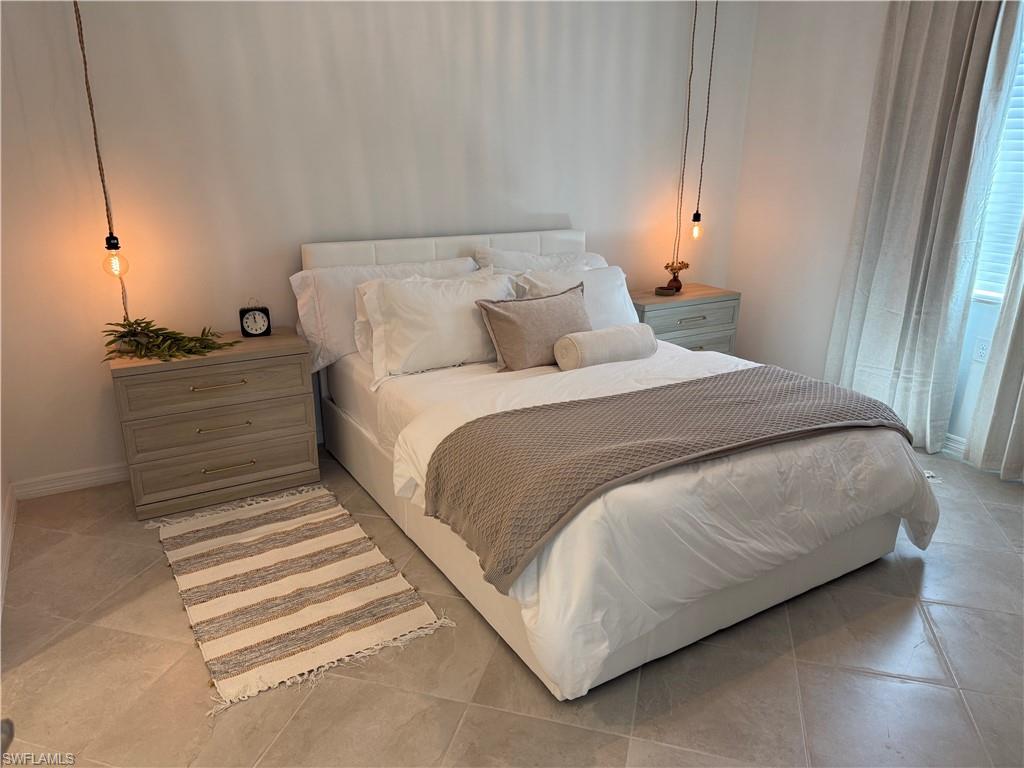 Tile flooring, built-in window blinds, pendant lighting fixtures, and light-toned walls