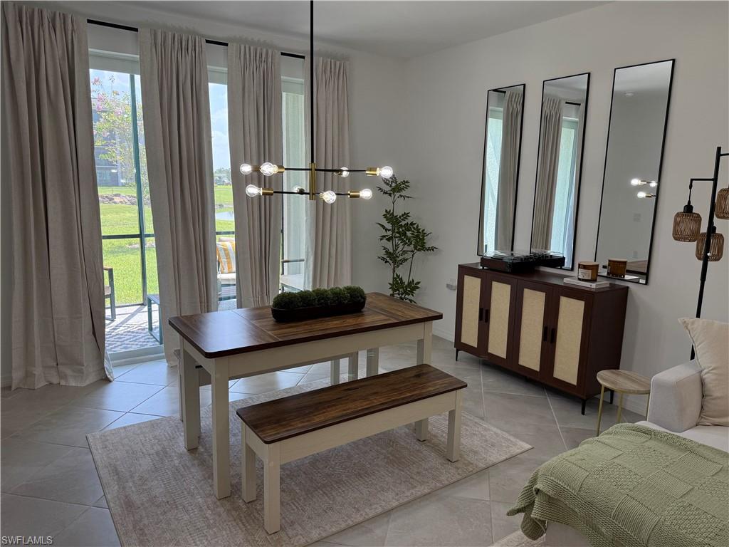 Recessed lighting, tile flooring, and a modern linear chandelier