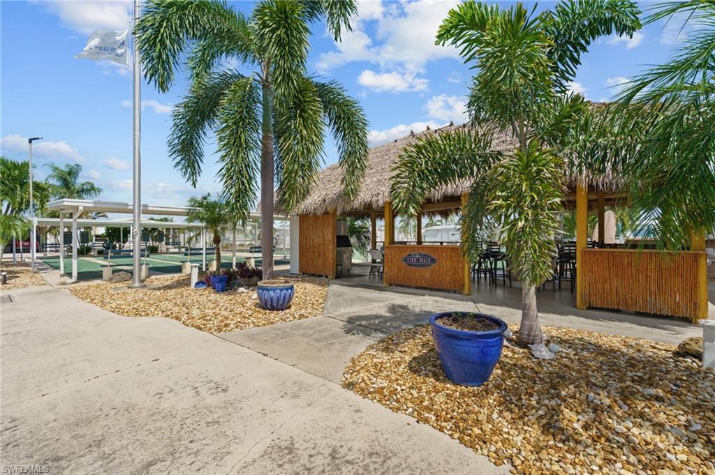Community tiki hut provides a tropical gathering place for residents.