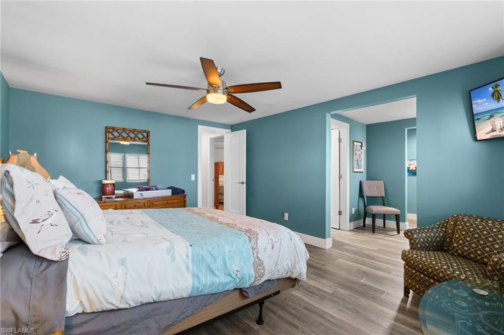 Primary suite with updated finishes and access to a large walk-in closet.