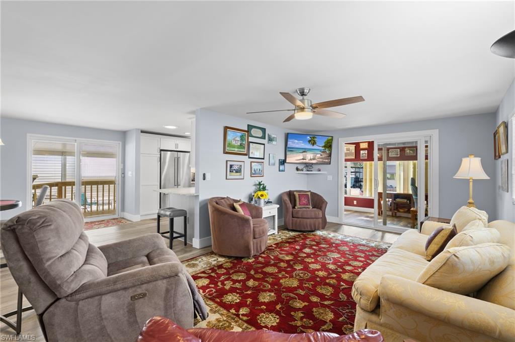 Comfortable living room with direct access to the Florida room/den.