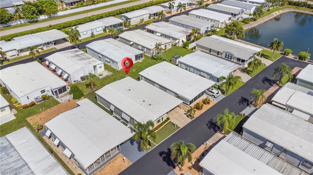 Aerial view of the home and permitted 2023 TPO membrane roof.