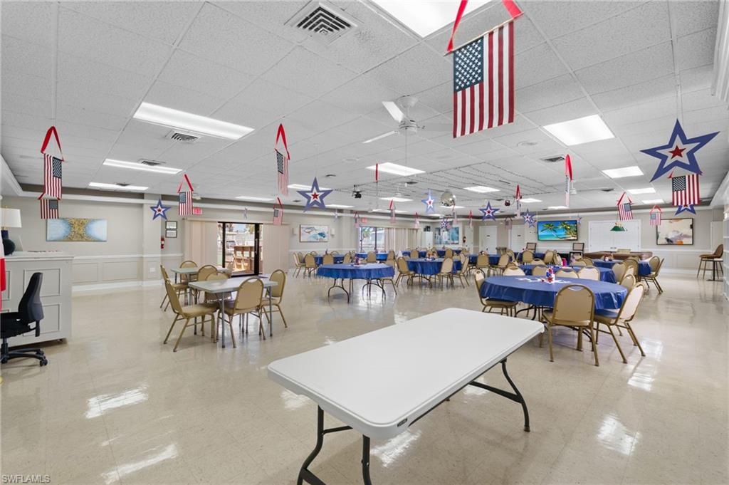 Community recreation room with table tennis and space for organized activities.
