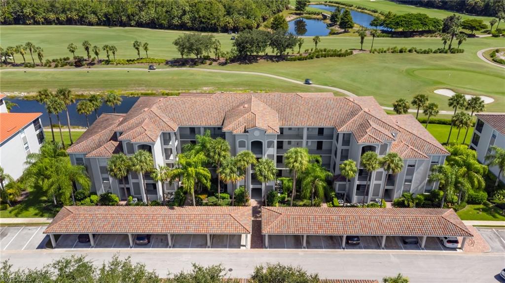 Multi-story stucco exterior with tile roofing