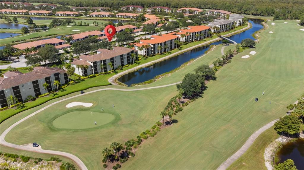 Championship golf course with manicured fairways, strategic bunkers, and water hazards throughout