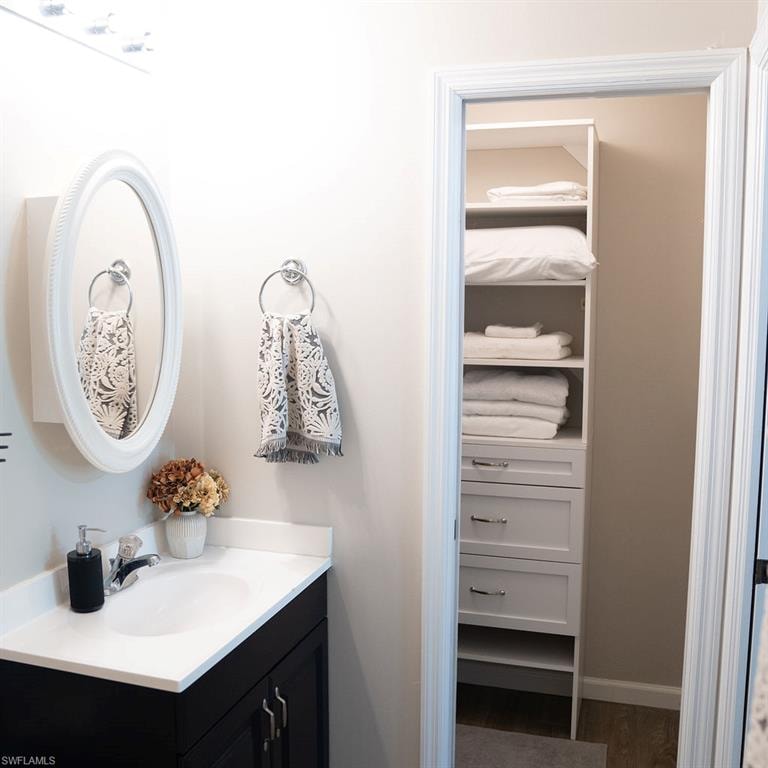 PRIMARY BATH & WALK IN CLOSET.