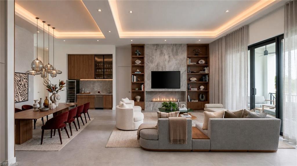 (Rendered photo) Recessed and cove lighting, built-in shelving, a linear fireplace, a wet bar with integrated appliances, and sliding glass doors with balcony access