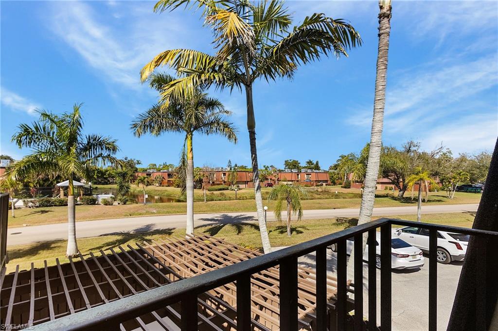 The view from the master overlooks the pergola-ed private patio. The small pond can be viewed from afar, too.