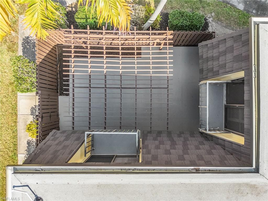 Birds eye view of the pergola covered patio, and decorative Juliette balconies.