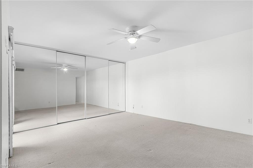Master Bedroom w/mirrored closet doors.