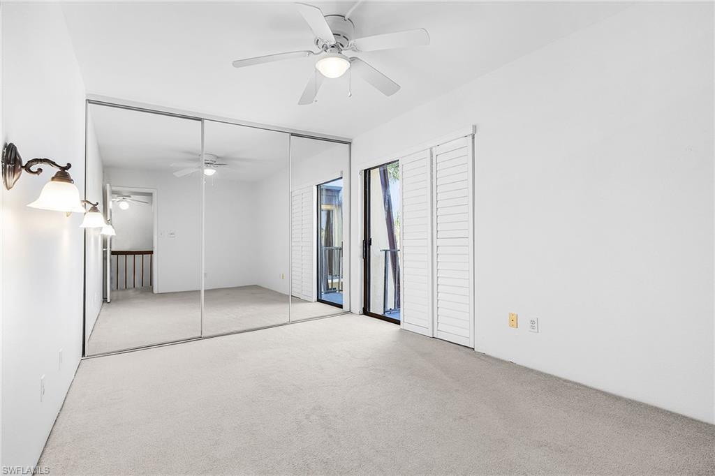 2nd bedroom w/mirrored closet doors, plantation shutter covers the sliding doors.