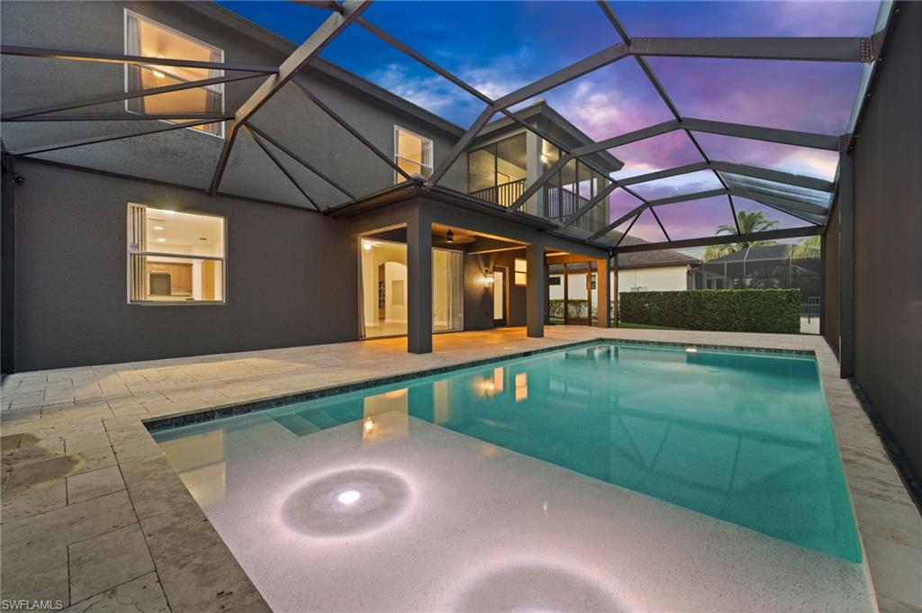 Expansive screened pool and lanai overlooking the canal and private dock create an ideal setting for Southwest Florida indoor-outdoor living. The spacious pool deck provides plenty of room for dining, entertaining, and relaxing while enjoying the waterfront views.