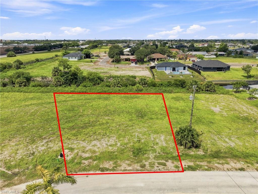 Grassed lot with partial paved road frontage