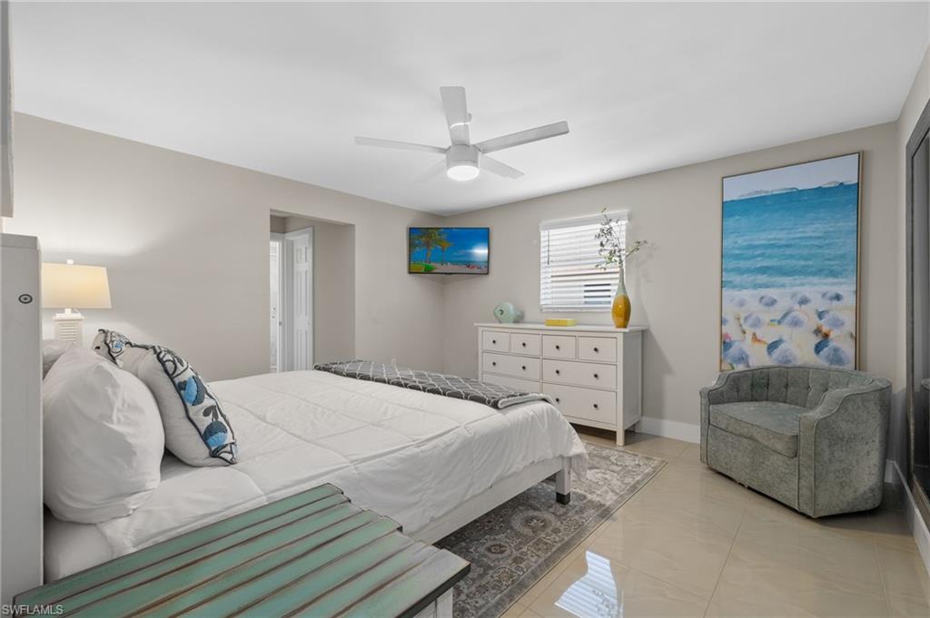 Tiled bedroom with ceiling fan