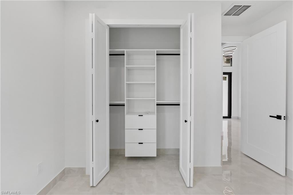 Integrated closet organization system featuring shelving and drawers