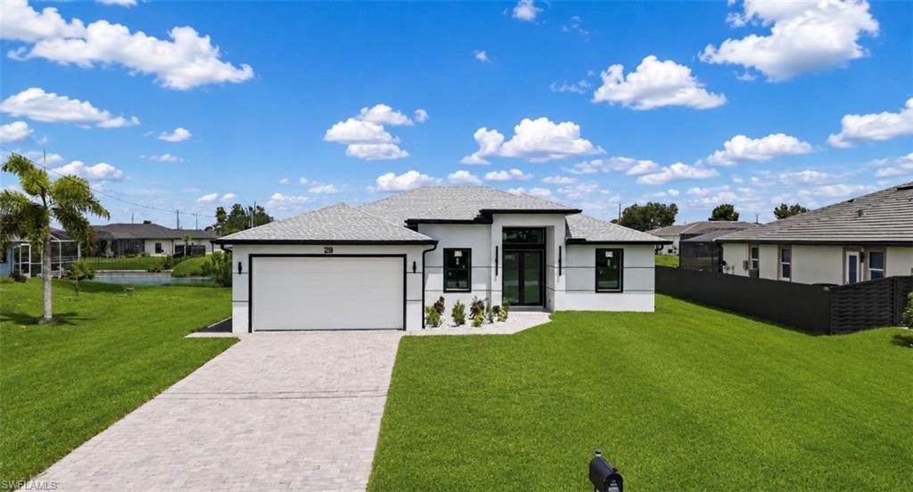 Contemporary exterior with a white stucco finish and dark trim accents