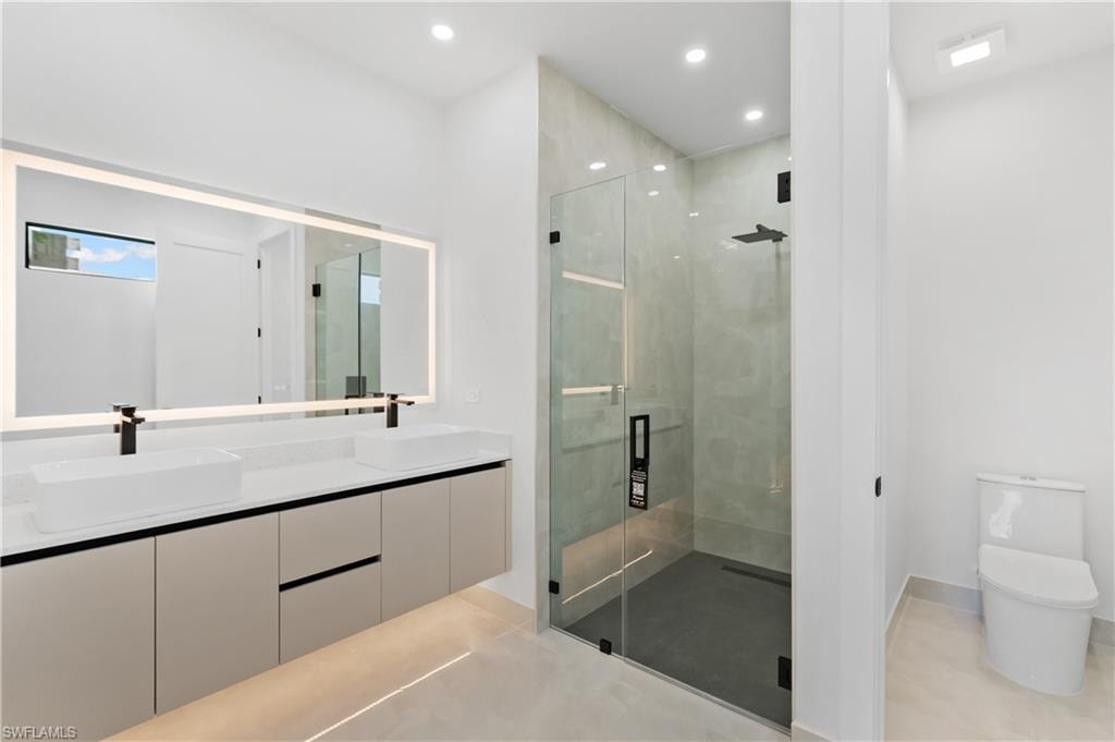 Dual vanity with rectangular vessel sinks and black fixtures