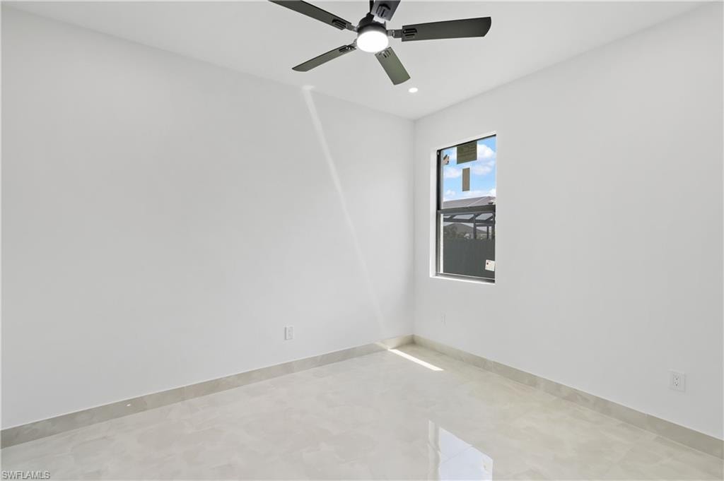 White walls, single window, tiled flooring, ceiling fan with integrated lighting, recessed lighting