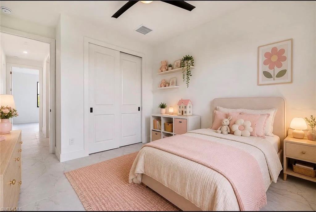 Recessed lighting, sliding closet doors, and a ceiling fan