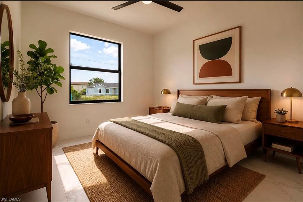 Bright room with white walls, a black ceiling fan, a large window, and light-colored flooring