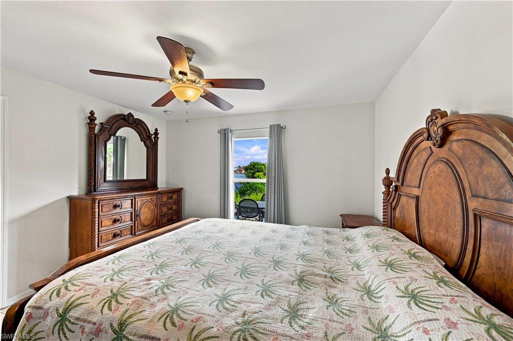 Recessed lighting, ceiling fan with integrated lighting, and window with natural light