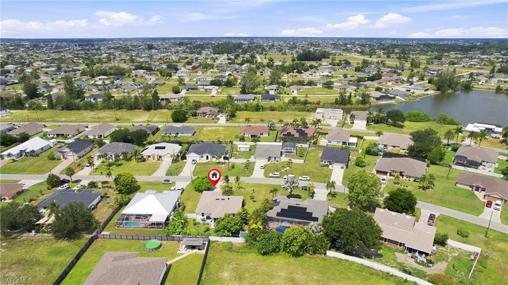 Residential property situated within a developed neighborhood, featuring a structured street grid and established landscaping