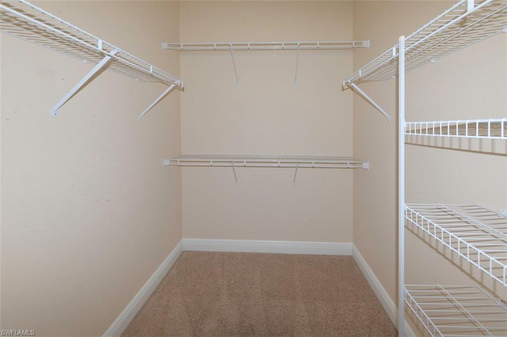 One of two walk-in closets in primary suite