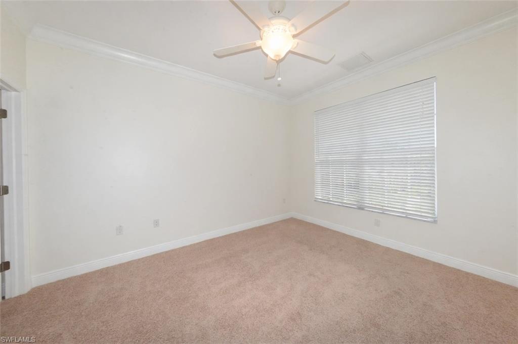 Large Guest bedroom with spacious walk-in closet and large window offering lots of natural light.