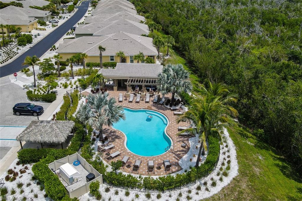 Second Heated pool area for more intimate gatherings features ample seating arrangements, bathrooms and grilling area.