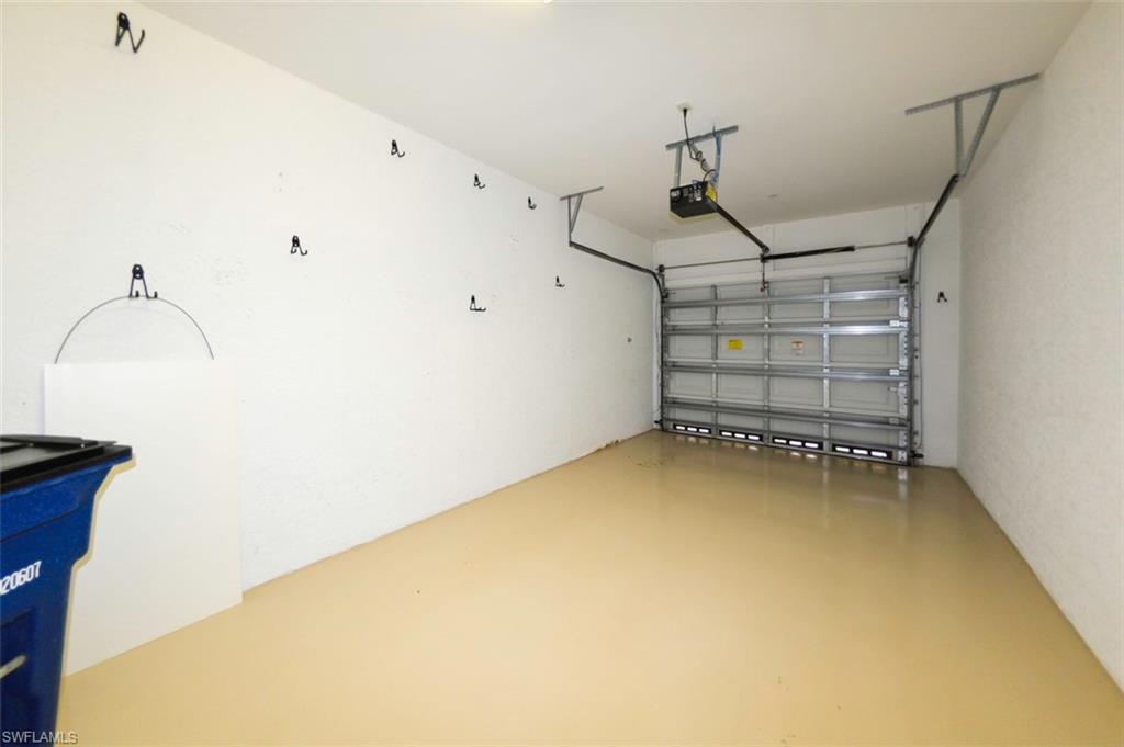 Spacious attached one car garage provides entry through foyer inside. Extra storage closet in downstairs foyer off garage.