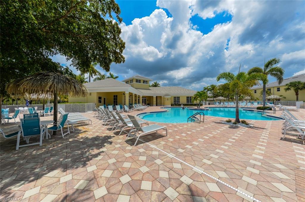 Main Resort style pool with large brick paved decking and large areas for sunning and choices for covered seating as well.