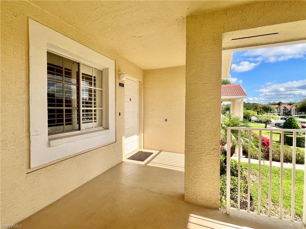 View of exterior entry with stucco siding