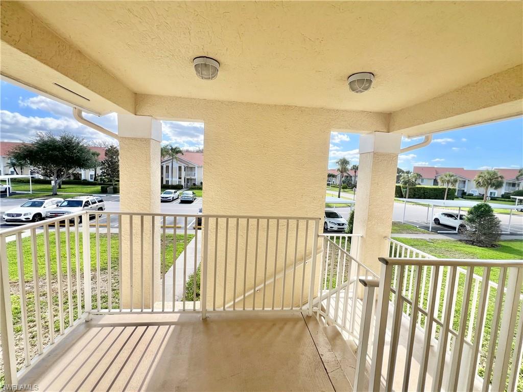 Balcony featuring covered porch and a residential view