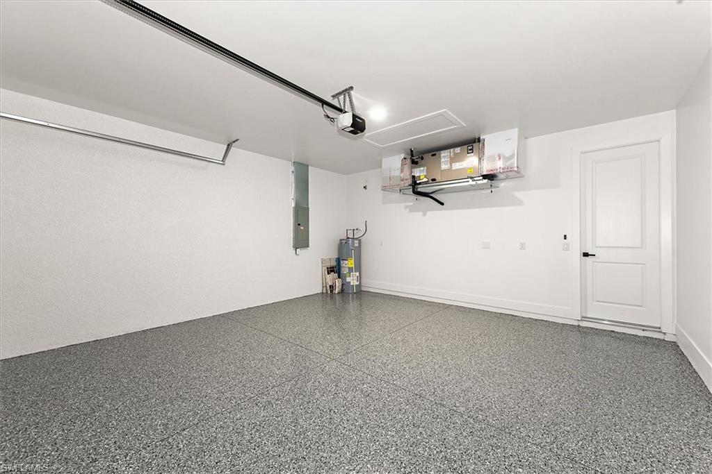 This garage view you will notice the hvac is mounted high so it is out of the way, but still very easy to access for routine maintenance. Hot water heater in the back left corner.