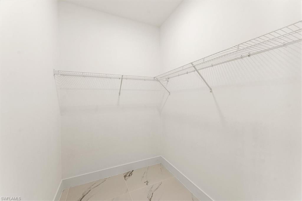 Primary bedroom closet. This picture is a mirror to each of the two closets.