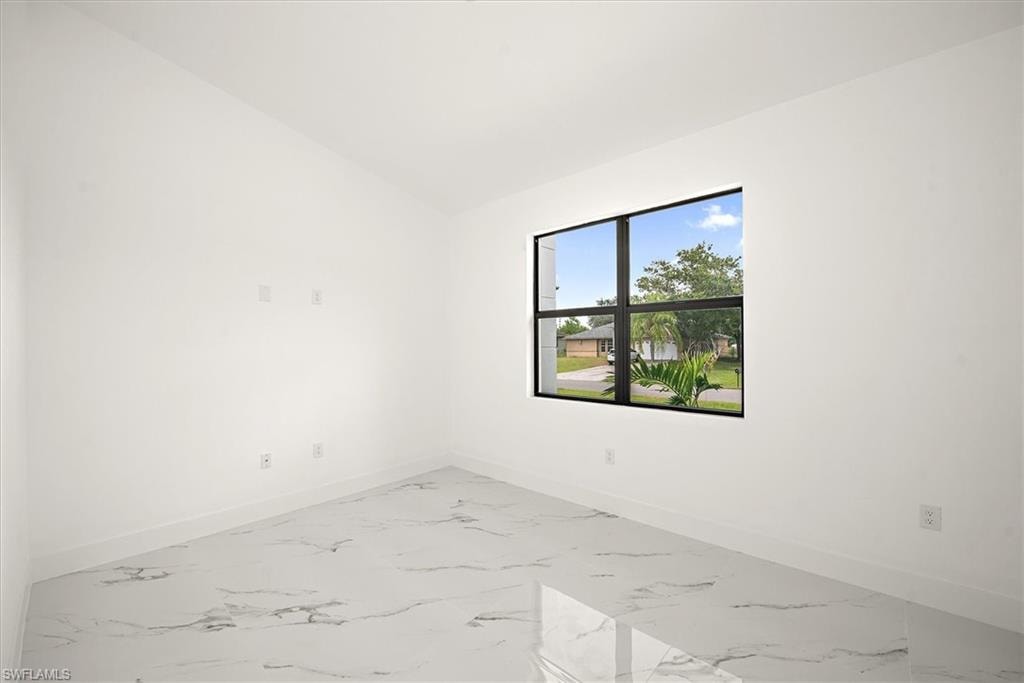 This picture is of the flex room which is located just behind the kitchen wall. It offers a vaulted ceiling and a front window view.
