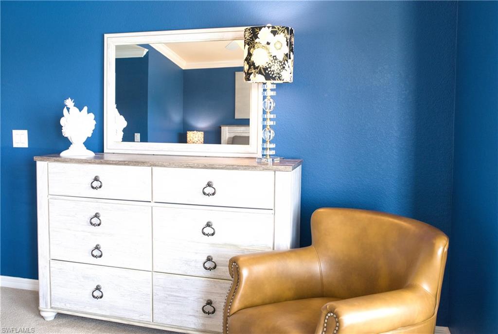 Dresser with a light-toned countertop and decorative pull handles